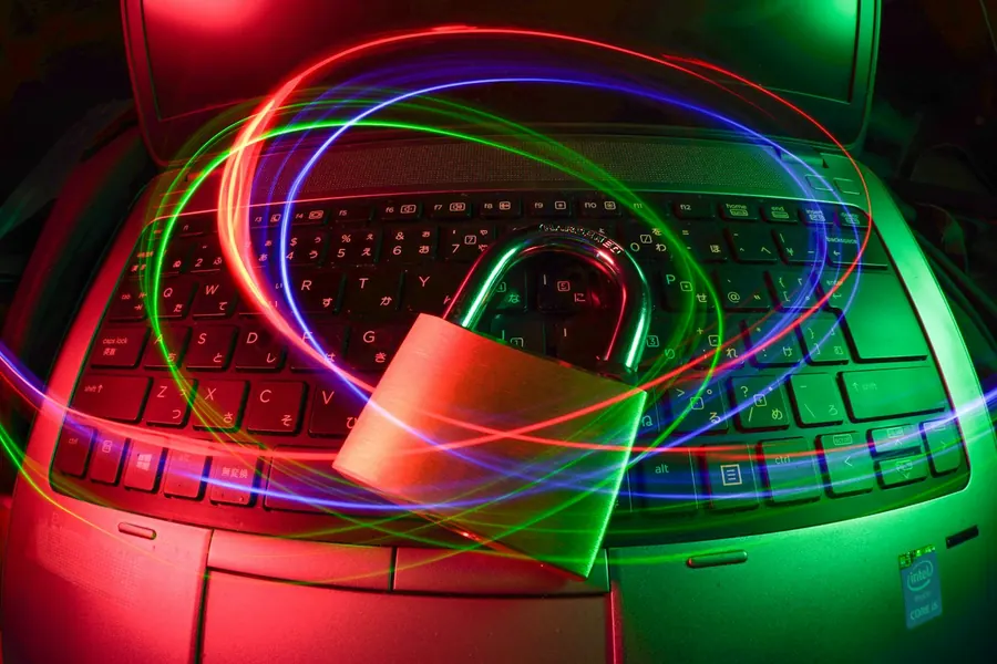 A padlock on a laptop with trails of light